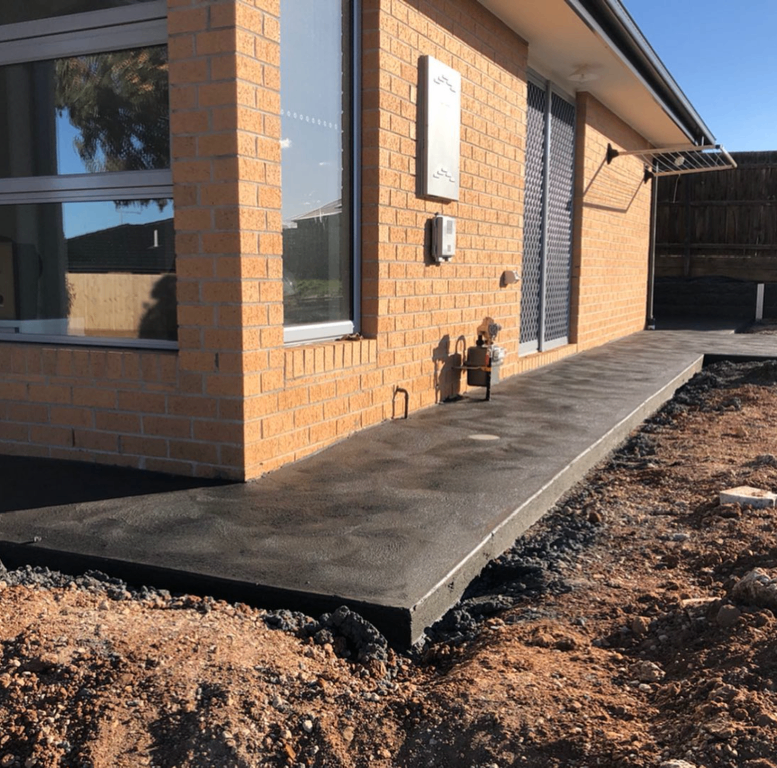 Specialised concrete path alongside a brick home, Ballarat Concreting and Earthworks
