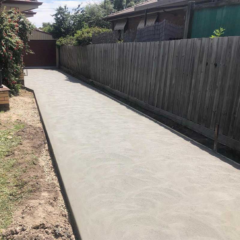 Finished concrete driveway between house and fence, Ballarat Concreting and Earthworks